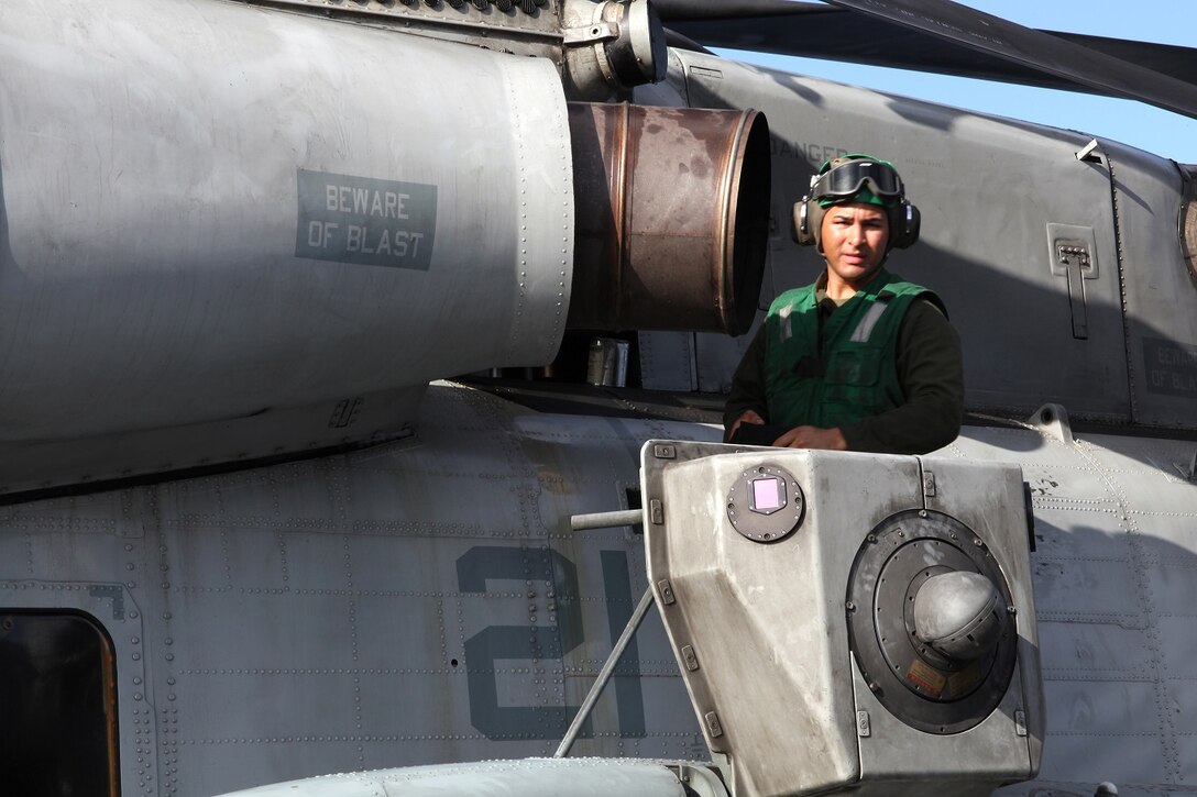 U.S. Marine Lance Cpl. Jaime Torrez provides maintenance on a CH-53E Super Stallion aboard USS Essex (LHD 2) at sea in the Pacific Ocean, May 17, 2015. Torrez is an airframe mechanic with Marine Medium Tiltrotor Squadron 161 (Reinforced), 15th Marine Expeditionary Unit. The aviation combat element of the 15th MEU maintains a state of combat readiness through constant upkeep on aircraft while on deployment. (U.S. Marine Corps photo by Staff Sgt. Miguel Carrasco/Released)
