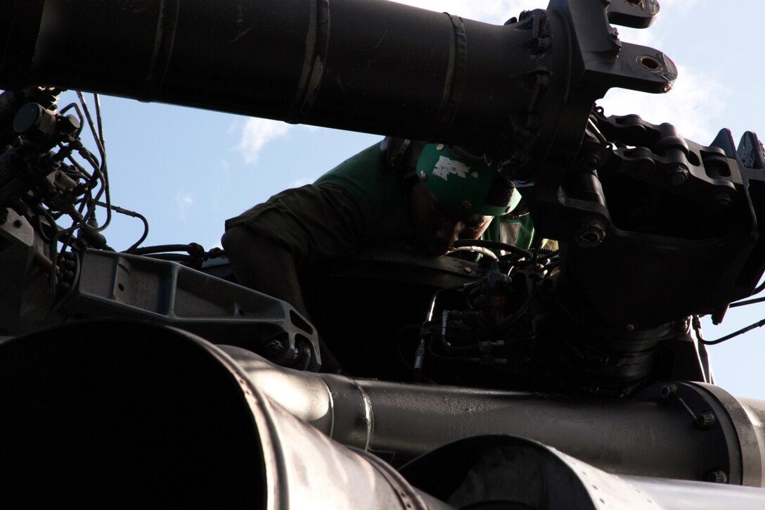 U.S. Marine Lance Cpl. Selim Griggsross provides maintenance on a CH-53E Super Stallion aboard USS Essex (LHD 2) at sea in the Pacific Ocean, May 17, 2015. Griggsross is an airframe mechanic with Marine Medium Tiltrotor Squadron 161 (Reinforced), 15th Marine Expeditionary Unit. The aviation combat element of the 15th MEU maintains a state of combat readiness through constant upkeep on aircraft while on deployment.  (U.S. Marine Corps photo by Staff Sgt. Miguel Carrasco/Released)