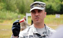 Maj. Jason V. Sama, Joint Non-Lethal Weapons Directorate, instructs U.S. Naval War College students on the non-lethal 12 gauge fin-stabilized round at Camp Fogarty Training Center, Rhode Island National Guard on May 13, 2015. The students participated in Range Day, which is part of the JPME's elective course, "Non-Lethal Weapons: Supporting the Operational Art Across the Range of Military Operations."