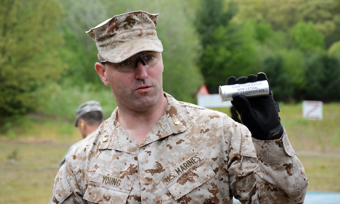 Maj. Peter B. Young, Joint Non-Lethal Weapons Directorate, instructs U.S. Naval War College students on the 40mm foam baton round at Camp Fogarty Training Center, Rhode Island National Guard on May 13, 2015. The students participated in Range Day, which is part of the JPME's elective course, "Non-Lethal Weapons: Supporting the Operational Art Across the Range of Military Operations."