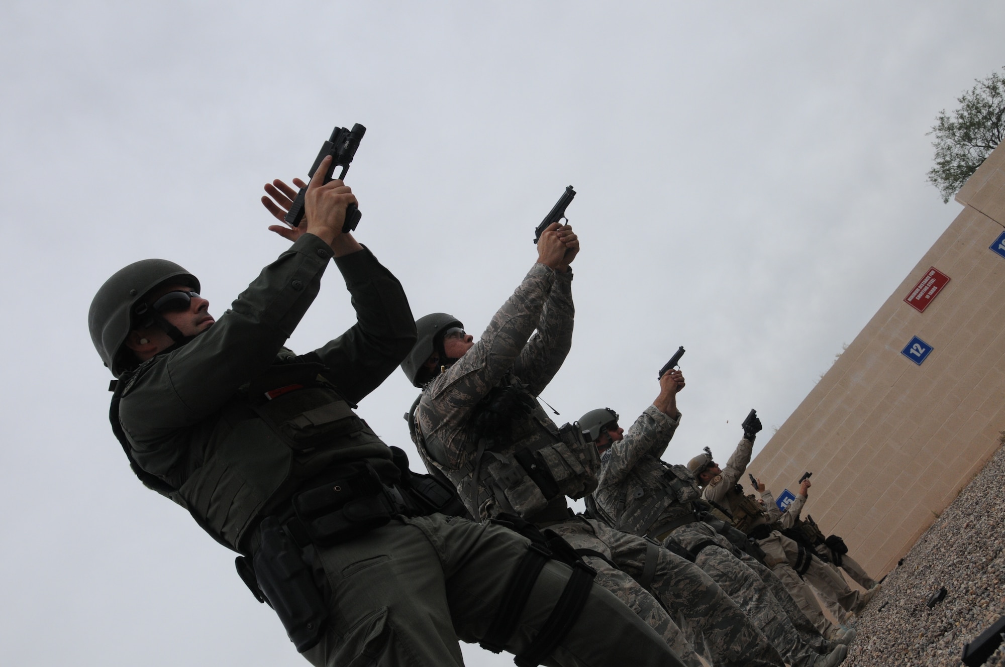 Airmen of the 162nd Wing and local law enforcement personnel participated in an annual SWAT training course in Tucson.  Tech. Sgt. Sam Alanis and Staff Sgt. Louis Duran from the Security Forces Squadron experienced what it takes to be a part of the Pima Regional SWAT team.  (U.S. Air National Guard photo by Senior Airman Jackson Hurd) 