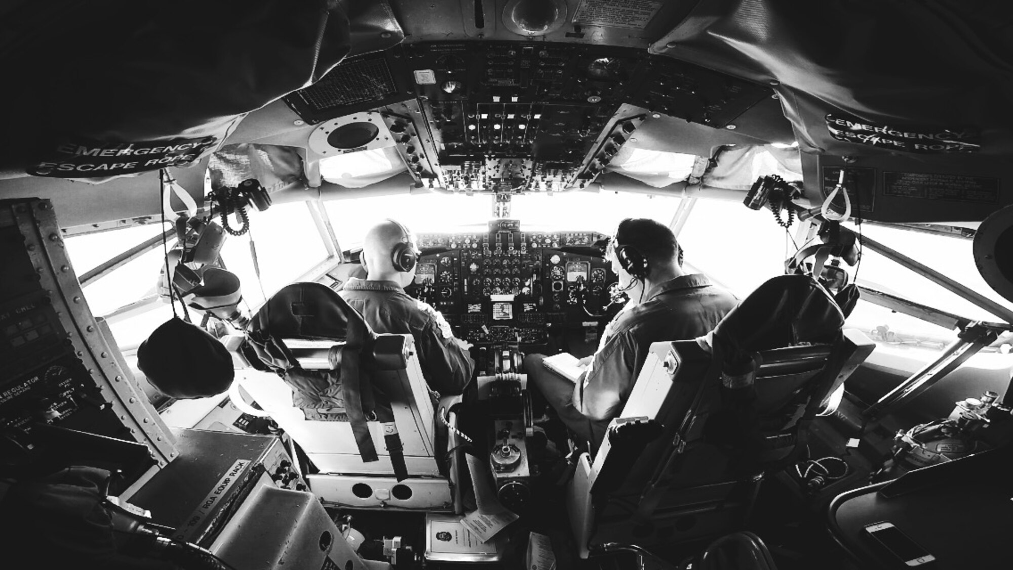 Capt. Ryan Miller and Maj. Dan Allen, pilot evaluators for the 96th Air Refueling Squadron, perform preflight checks of a KC-135R Stratotanker on Joint Base Pearl Harbor-Hickam, Hawaii, May 19, 2015. The flight was held to conduct aerial refueling operations for six F-22 Raptors from the Hawaiian Raptors. The KC-135 aerial refueling capability enhances the Air Force’s ability to accomplish its primary mission of global reach. (U.S. Air Force photo by 2nd Lt. Kaitlin Daddona/Released)