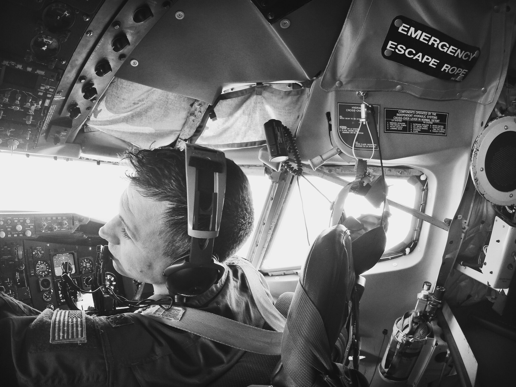 Maj. Dan Allen, pilot evaluator for the 96th Air Refueling Squadron, sits co-pilot on a KC-135R Stratotanker flight on Joint Base Pearl Harbor-Hickam, Hawaii, May 19, 2015. The flight was held to conduct aerial refueling operations for six F-22 Raptors from the Hawaiian Raptors. The KC-135 aerial refueling capability enhances the Air Force’s ability to accomplish its primary mission of global reach. (U.S. Air Force photo by 2nd Lt. Kaitlin Daddona/Released)