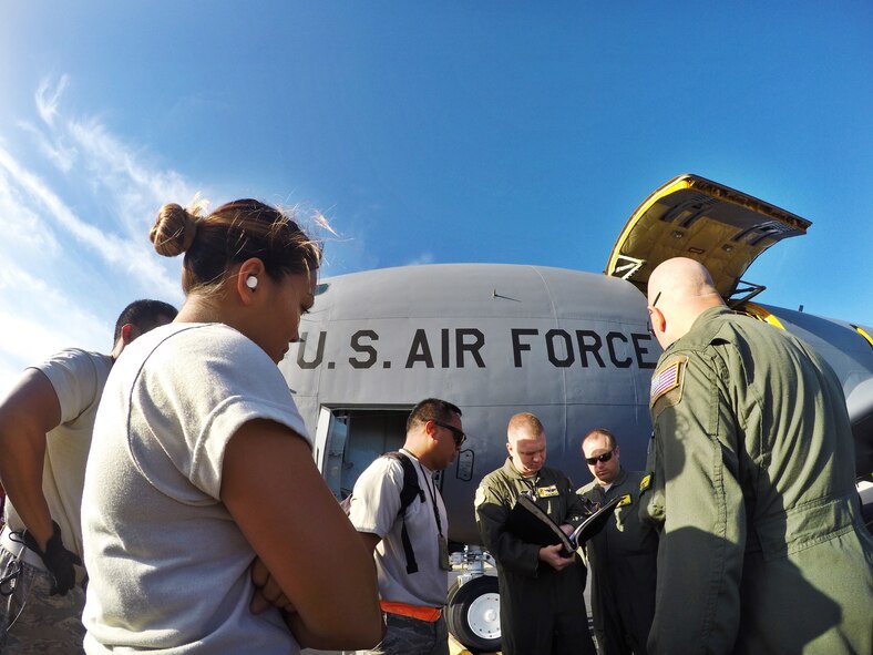 Capt. Ryan Miller, pilot evaluator for the 96th Air Refueling Squadron, briefs  his crew before a KC-135R Stratotanker flight on Joint Base Pearl Harbor-Hickam, Hawaii, May 19, 2015. The flight was held to conduct aerial refueling operations for six F-22 Raptors from the Hawaiian Raptors. The KC-135 aerial refueling capability enhances the Air Force’s ability to accomplish its primary mission of global reach. (U.S. Air Force photo by 2nd Lt. Kaitlin Daddona/Released))