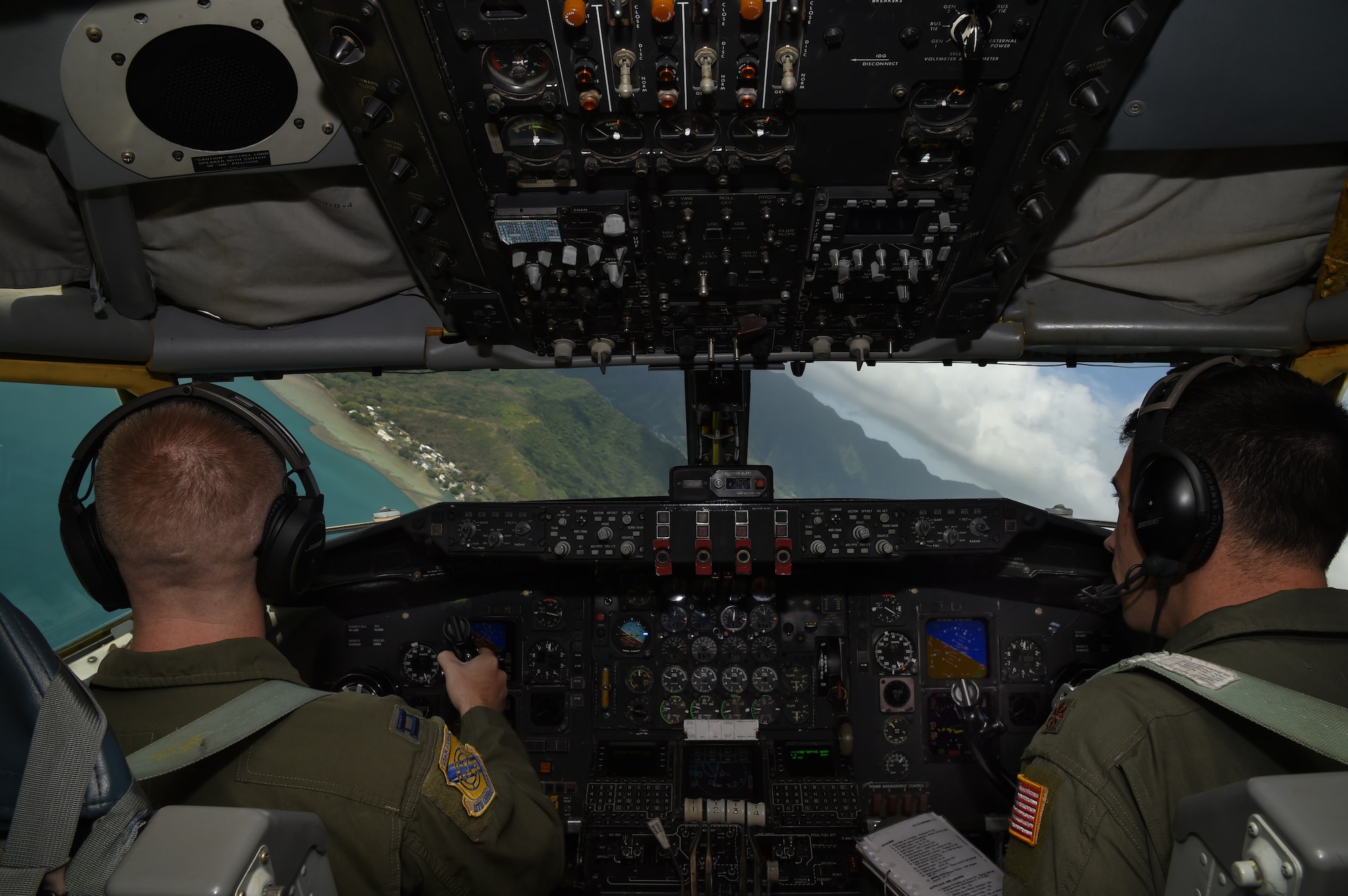 (Left)Capt. Ryan Miller, and Maj. Dan Allen, both pilots for the 96th Air Refueling Squadron, turn the KC-135R Stratotanker in preparation for a touch and go landing on Marine Corps Air Station at Kaneohe Bay, Hawaii, May 19, 2015. (U.S. Air Force photo by Tech. Sgt. Aaron Oelrich/Released)