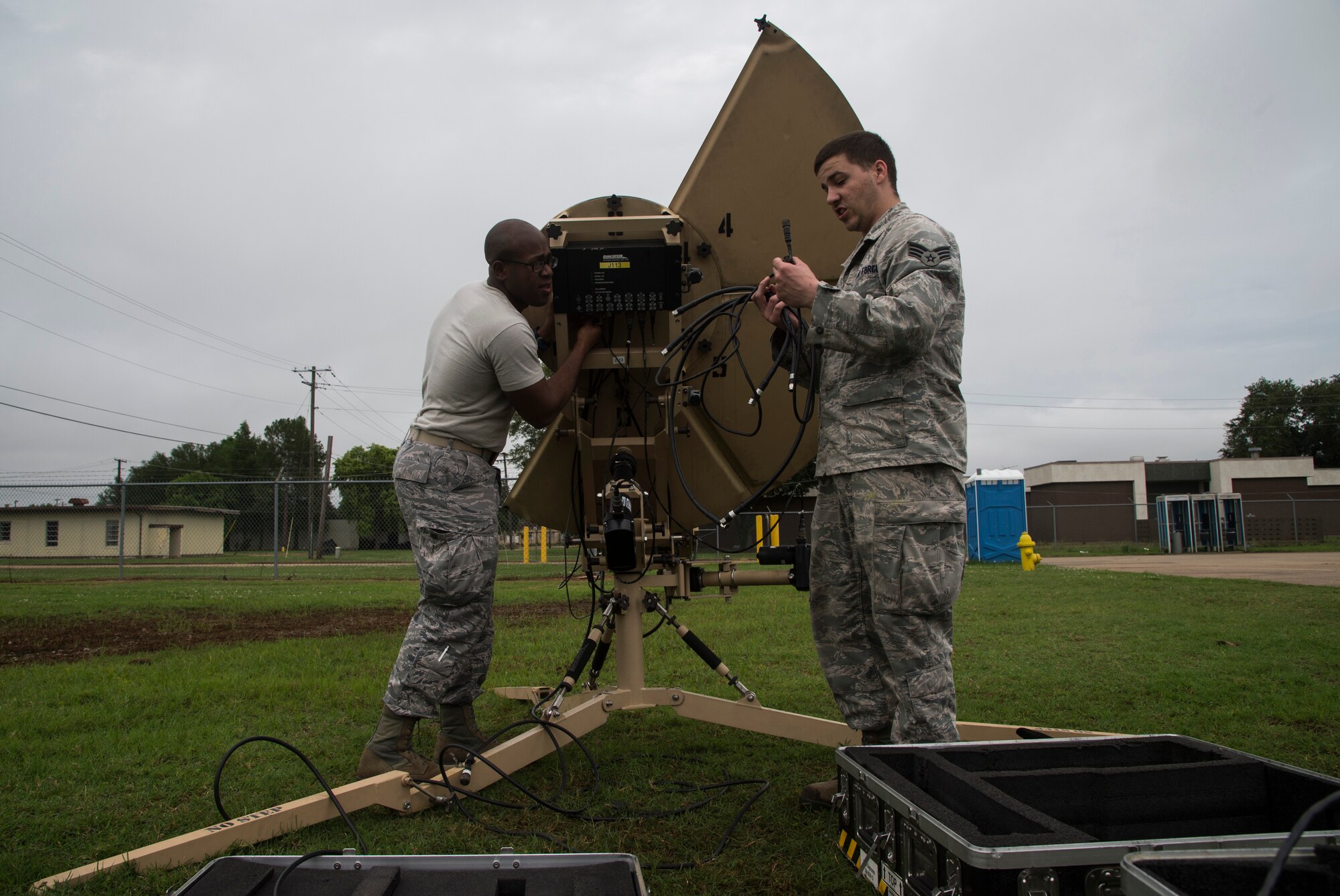 Staff Sgt. Daniel Logan and Senior Airmen Michael Deits, assigned to the 819th Global Support Squadron stationed at Joint Base McGuire-Dix-Lakehurst, N.J., sets up an antenna during the Joint Readiness Training Center exercise 15-07, May 12, 2015, at the Alexandria International Airport, La. The antenna can provide phone and internet capabilities anywhere in the world. (U.S. Air Force photo/Staff Sgt. Gustavo Gonzalez/RELEASED)