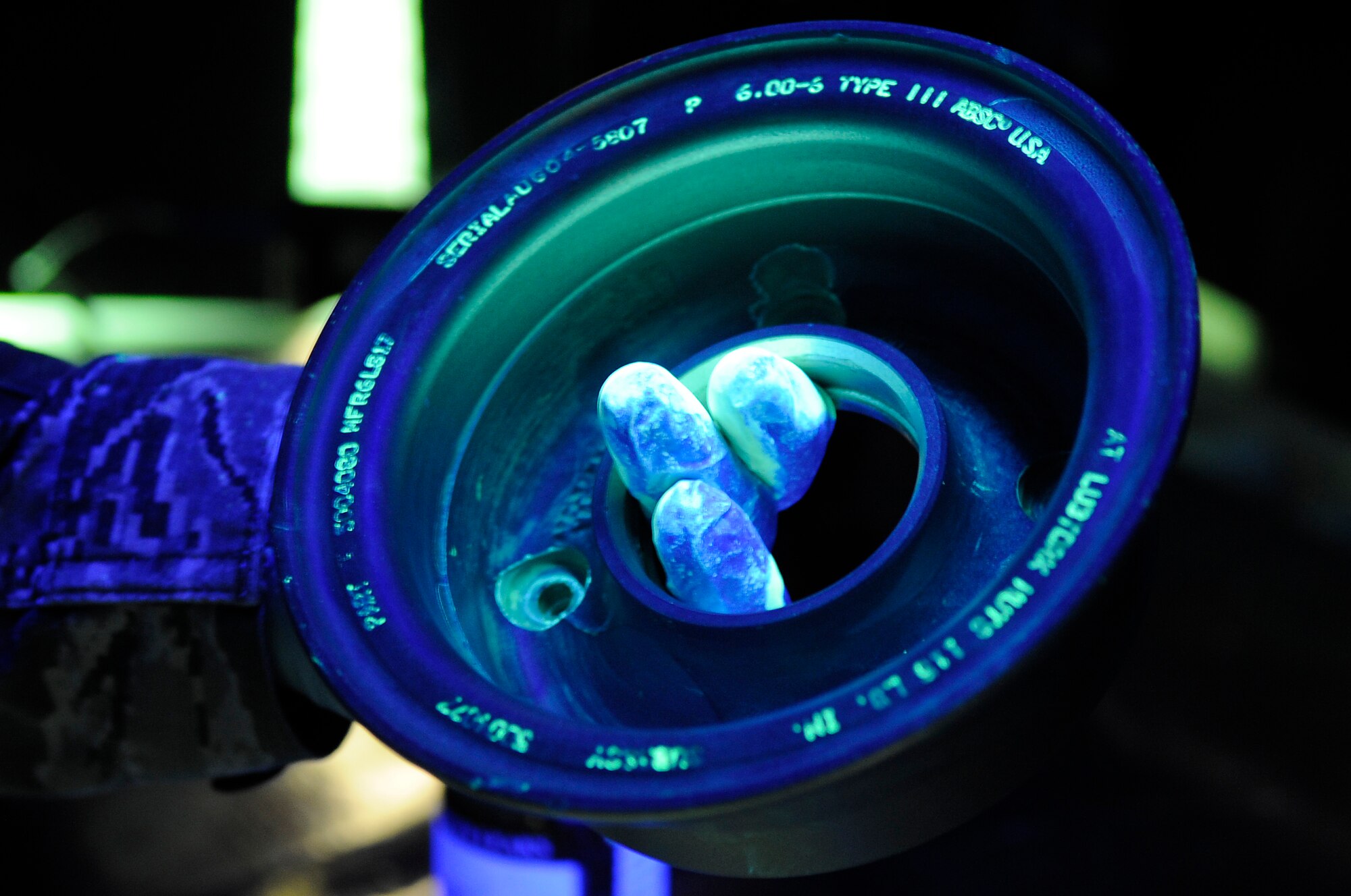 U.S. Air Force Airman 1st Class William Ivey, 18th Equipment Maintenance Squadron Nondestructive Inspection technician, checks an aircraft part for cracks at the NDI shop on Kadena Air Base, Japan, May 19, 2015. NDI uses multimillion-dollar equipment including an X-ray machine and a special dye that glows under a black light to inspect the integrity of roughly 500 parts a month. (U.S. Air Force photo by Staff Sgt. Marcus Morris)