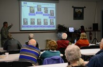 Col. Chris Phillips, left, 341st Medical Group commander, delivers a base briefing to retirees May 16, 2015, at Malmstrom Air Force Base, Mont. Phillips started a string of briefings aimed at informing the retirees about all their on base entitlements. (U.S. Air Force photo/ Airman 1st Class Dillon Johnston)