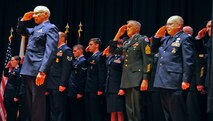 Retirees salute during a retreat ceremony May 15, 2015, at Malmstrom Air Force Base, Mont. The retreat ceremony honored both retirees and National Police Week. (U.S. Air Force photo/ 2nd Lt. Annabel Monroe)