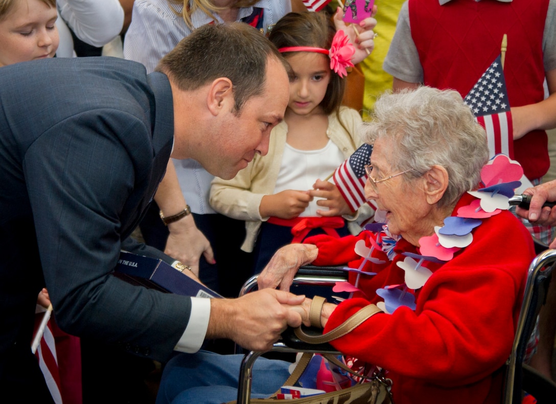 Marlin Stutzman, an Indiana Congressman, greets a 101-year-old Army veteran after arriving at Ronald Reagan National Airport in Washington, D.C., May 20, 2015. She is the oldest veteran of the Northeast Indiana Honor Flight. The Honor Flight Network is a non-profit organization created to honor America’s veterans for all their sacrifices by bringing them to visit and reflect at their memorials. (U.S. Air Force photo/Airman 1st Class Ryan J. Sonnier)