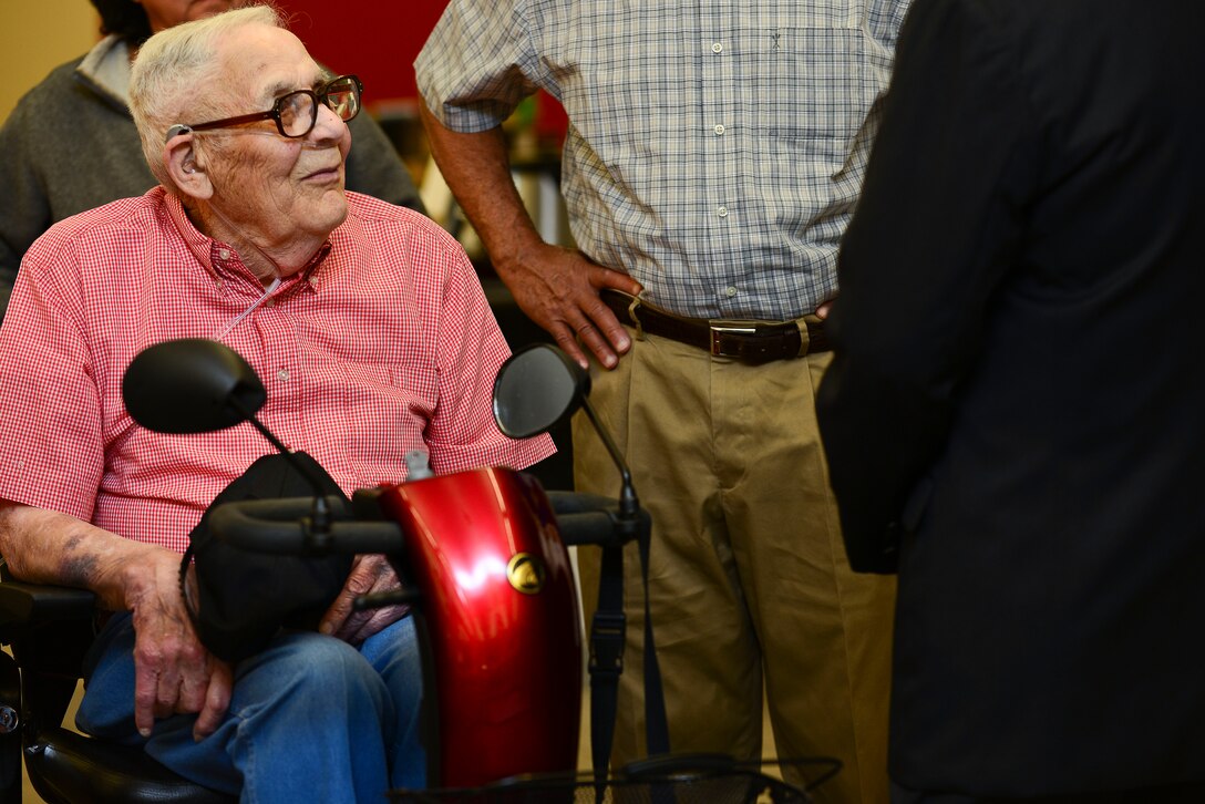 Eulan Chism, a retired World War II veteran, speaks with others during the Joint Base Langley-Eustis Retiree Appreciation Day at Fort Eustis, Va., May 16, 2015. Chism is an active member of Fort Eustis, attending church services every week and making an effort to attend every Retiree Appreciation event.  (U.S. Air Force photo by Senior Airman Kimberly Nagle/Released)  