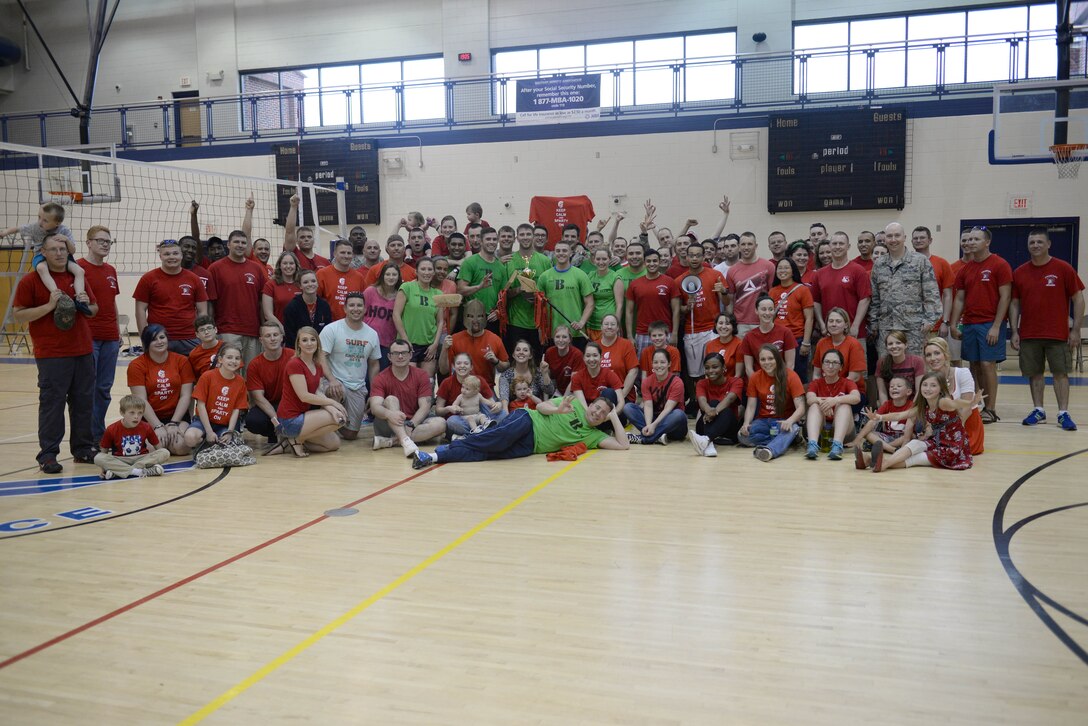 Members of the 30th Intelligence Squadron pose for a group photo after winning the intramural volleyball championship game at Langley Air Force Base, Va., May 19, 2015. The 30th IS beat out the 45th IS with a score of 25 to 21. (U.S. Air Force photo by Staff Sgt. Teresa J. Cleveland/Released)
