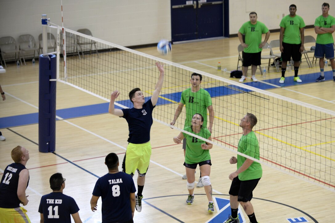 Doug Brown, 45th Intelligence Squadron, spikes the ball during the intramural volleyball championship game at Langley Air Force Base, Va., May 19, 2015. The 45th IS lost the game with a score of 21 to 25. (U.S. Air Force photo by Staff Sgt. Teresa J. Cleveland/Released)