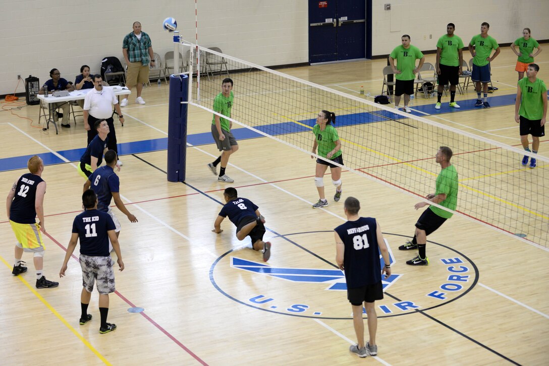 Members from the 30th and 45th Intelligence Squadrons compete in an intramural volleyball championship game at Langley Air Force Base, Va., May 19, 2015. The 30th IS won the championship with a score of 25 to 21. (U.S. Air Force photo by Staff Sgt. Teresa J. Cleveland/Released)