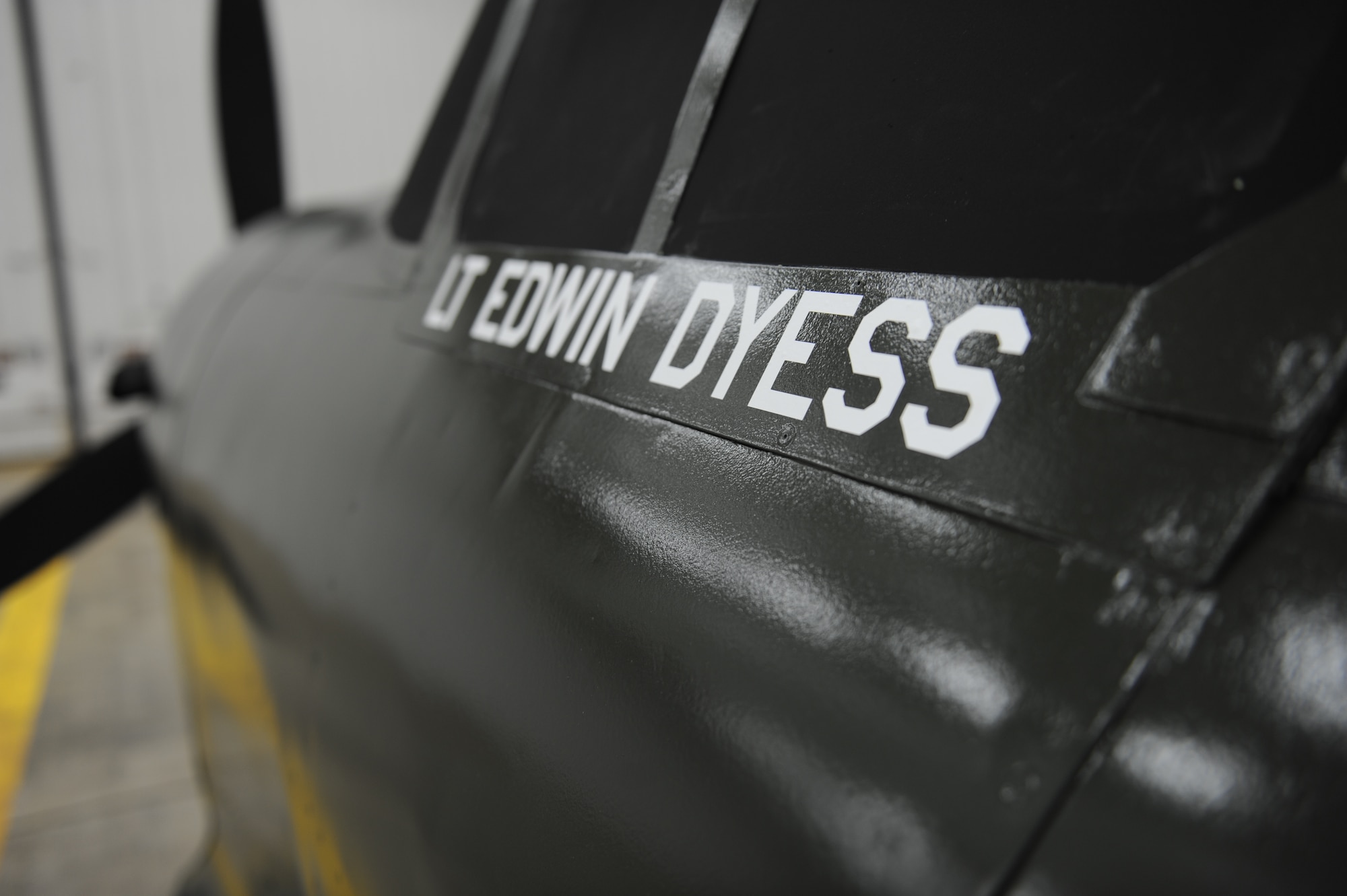 A replica of Lt. Col. William Edwin Dyess’ World War II fighter plane, a P-40 Warhawk nicknamed the “Kibosh,” sits in hangar with a fresh coat of paint and new stencils Sept. 5, 2013, at Dyess Air Force Base, Texas. (Courtesy Photo)