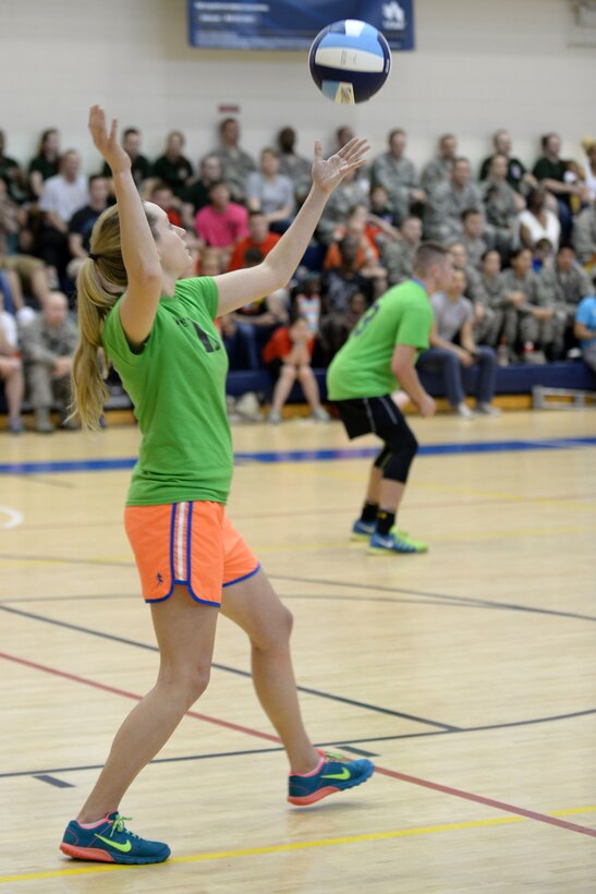 Carina Cunningham, 30th Intelligence Squadron, serves the ball during the intramural volleyball championship game at Langley Air Force Base, Va., May 19, 2015. Cunningham was part of the winning team who won by score of 25 to 21. (U.S. Air Force photo by Staff Sgt. Teresa J. Cleveland/Released) 