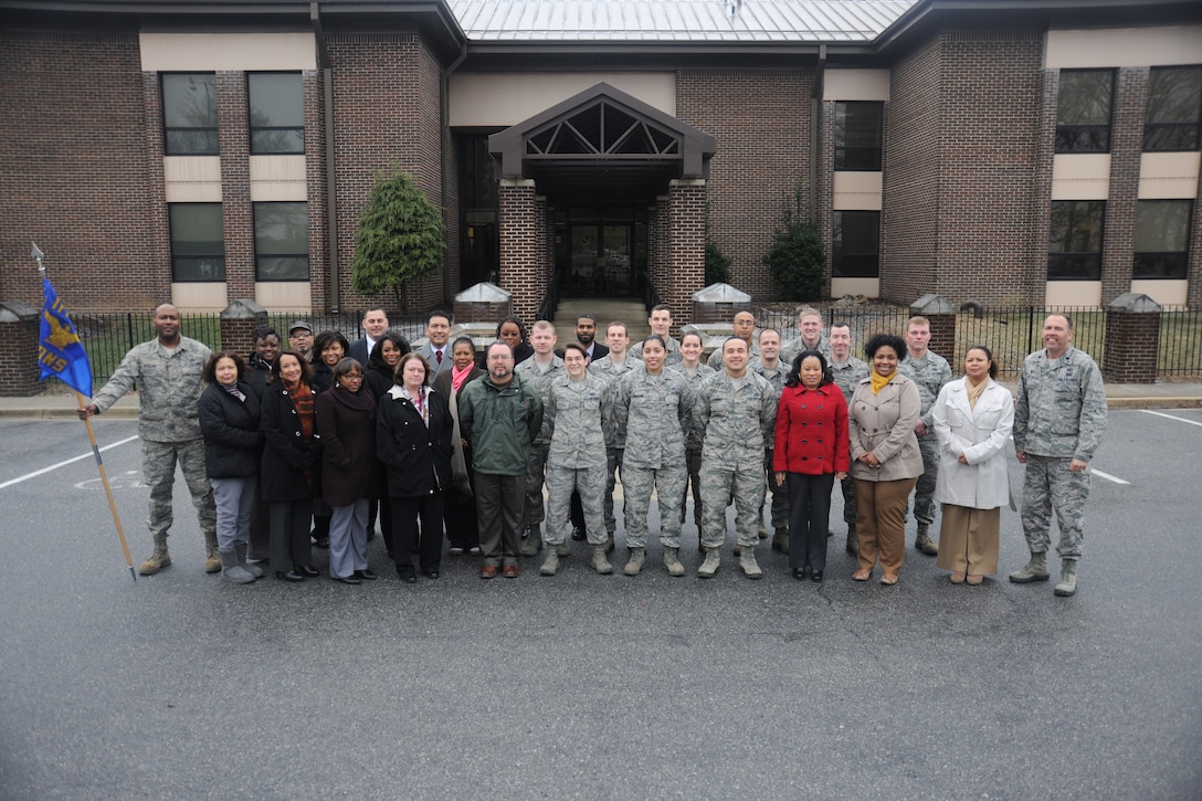 Members of the 11th Contracting Squadron pose for a photo at Joint Base Andrews, Md., Feb. 10, 2015. The 11 CONS won the 2014 Air Force Outstanding Contracting Unit (Small) Award. (U.S. Air Force photo/ Airman 1st Class J.D. Maidens)