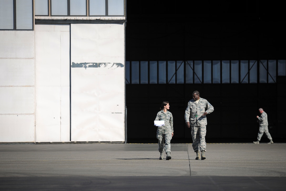 Airman 1st Class Ashley Almeida and Master Sgt. Kennard Hughes outside “The Thunderdome” at Eielson Air Force Base, Wednesday, May 14, 2015 during Red Flag-Alaska 15-2. (U.S. Air National Guard photo by Capt. Nathan Wallin)