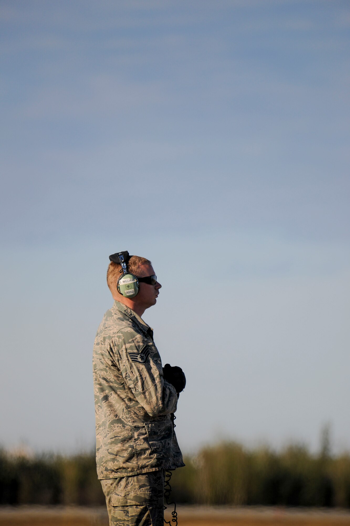 Staff Sgt. Burney Williams, a Crew Chief in 113th Wing’s Maintenance Squadron, stands ready on the flight line at Eielson Air Force Base, Tuesday, May 12, 2015 during Red Flag-Alaska 15-2.  (U.S. Air National Guard photo by Capt. Nathan Wallin)