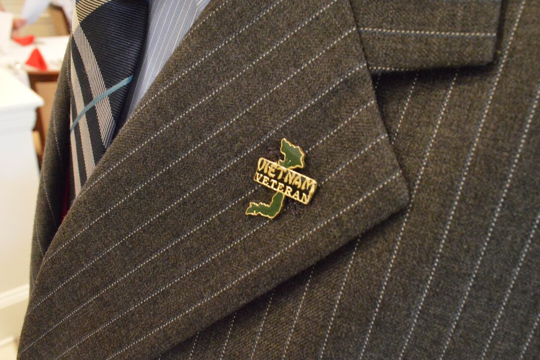 A Vietnam veteran pin is displayed on the lapel of a veteran during an Armed Forces Day pinning ceremony at a hospice in Williamsburg, Va., May 16, 2015. The pinning was part of a ceremony to honor the families and veterans who reside at the hospice. (Courtesy Photo) 