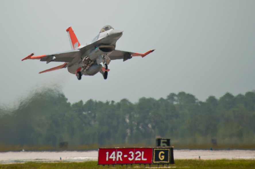 A QF-16 takes off from the runway May 12 at Tyndall Air Force Base, Fla. The QF-16 is a Full Scale Aerial Target that has been modified to be flown with a pilot in the cockpit for training and also without a pilot as a target for live missile testing. The 82nd ATRS received their first QF-16 in September of 2014 and will continue to transition their full scale aerial target program to the new model over the next several months. The 82nd ATRS operates QF-4, QF-16 and BQM-167 targets to provide manned and unmanned aerial targets support for programs across the Department of Defense.  (U.S. Air Force photo/Sara Vidoni)