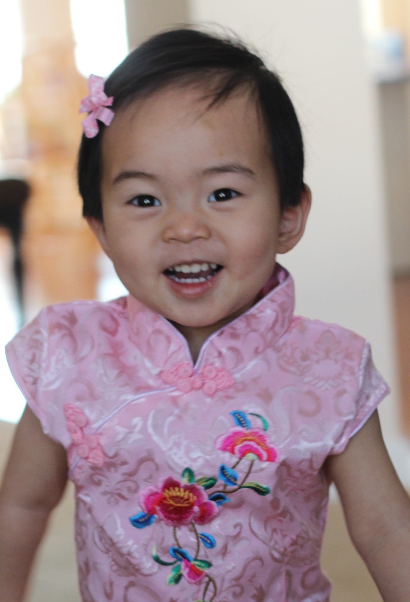 Susan, age 1, dresses up for Chinese New at her new home at Hanscom Air Force Base, Mass., Feb. 19, 2015. Susan was adopted by the Krueger family and matched through China's Waiting Child program. (courtesy photo)