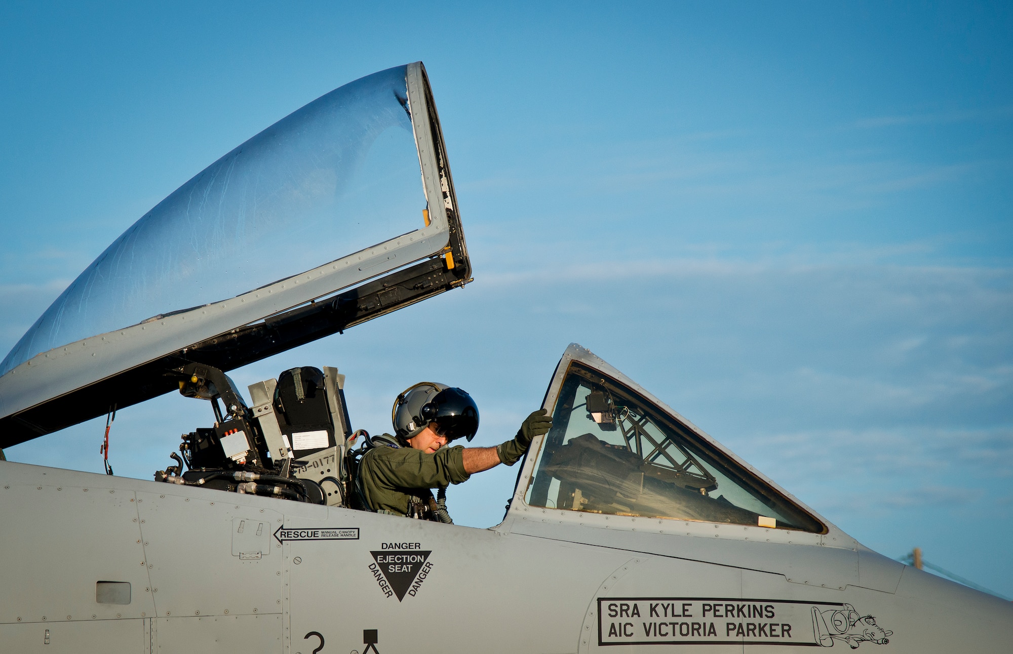Maj. Joe McGill, a flyer for the 40th Flight Test Squadron, performs preflight checks on an A-10 Thunderbolt II prior to a morning takeoff from Eglin Air Force Base, Fla., May 19.  The aircraft was loaded with approximately nine MK-82s, seven missiles and a full 30mm round load for the GAU-8. The sortie was to test the weapons worked properly with new aircraft software upgrades.  (U.S. Air Force photo/Samuel King Jr.)