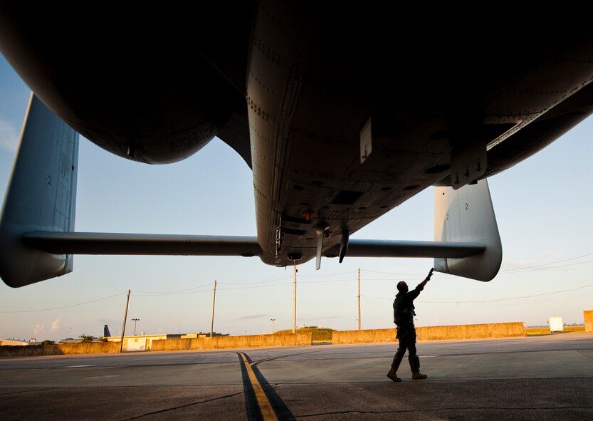 Maj. Joe McGill, a flyer for the 40th Flight Test Squadron, performs his preflight checks on an A-10 Thunderbolt II prior to a morning takeoff from Eglin Air Force Base, Fla., May 19.  The aircraft was loaded with approximately nine MK-82s, seven missiles and a full 30mm round load for the GAU-8. The sortie was to test the weapons worked properly with new aircraft software upgrades.  (U.S. Air Force photo/Samuel King Jr.)
