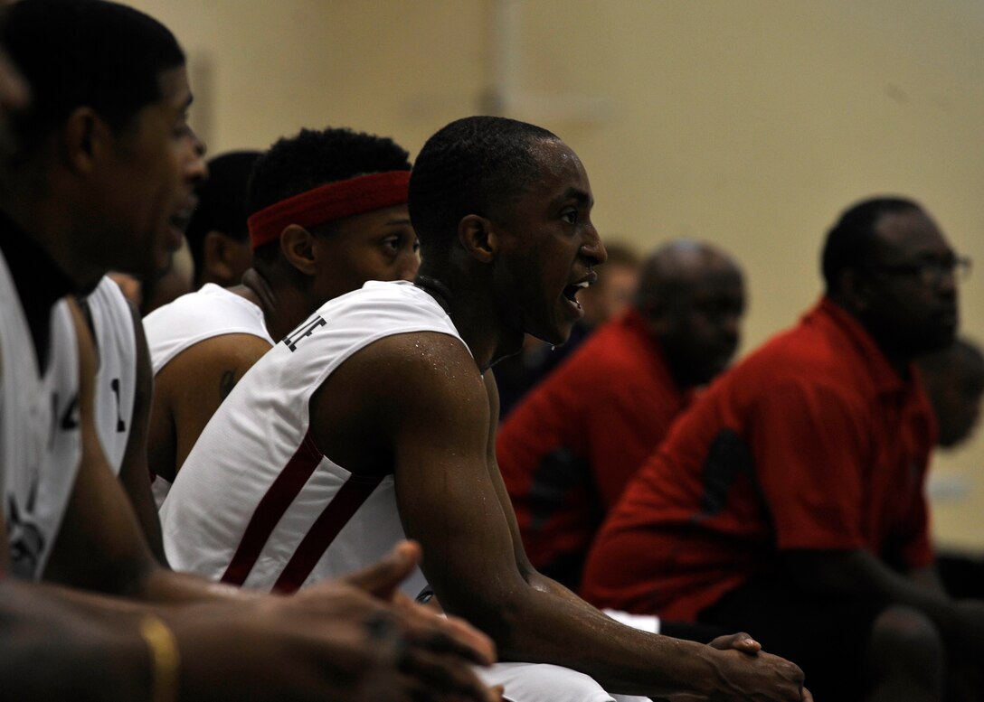 U.S. Senior Airman Marc Granville, 440th Supply Chain Operations Squadron security systems analyst, cheers for the Langley Raptors at the 1st Mid-Atlantic Intra-Military Basketball Tournament at Joint Base Langley-Eustis, Va., May 16, 2015. The double elimination tournament lasted two days and took place at the Shellbank Fitness Center. (U.S. Air Force photo by Senior Airman Breonna Veal)