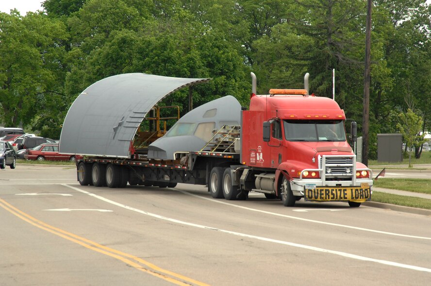 Disassembled sections of a C-17 cargo plane were delivered by truck to Wright-Patterson Air Force Base, Ohio the morning of May 18, 2015. The pieces are bound for the United States School of Aerospace Medicine (USAFSAM) and the co-located Air Mobility Command (AMC) Detachment 4, Formal Training Unit (FTU) for reassembly into an Aeromedical Evacuation (AE) training station. 
(U.S. Air Force photo by Al Bright / Released)