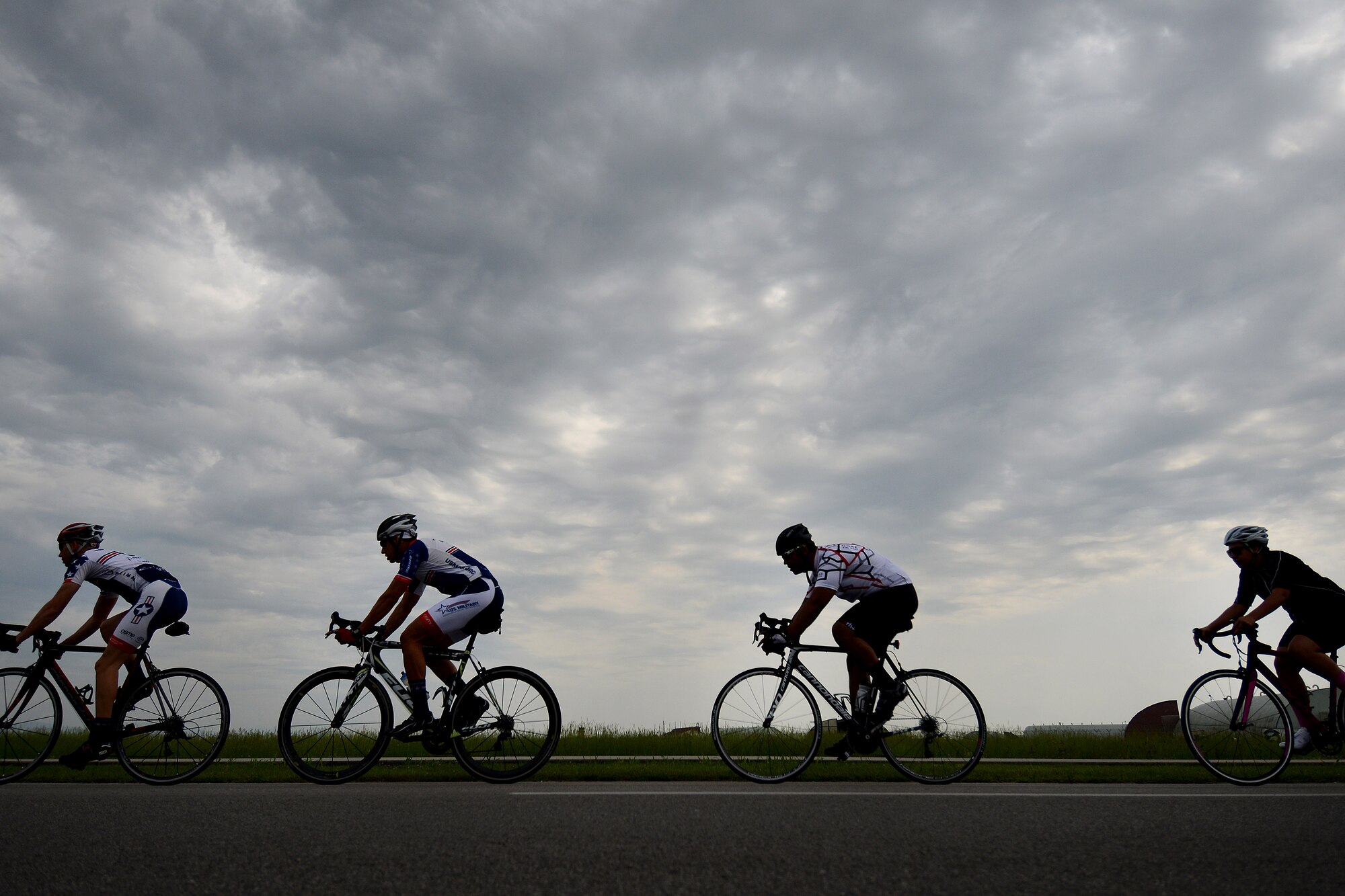 U.S. Air Force Airmen take off on a ride, May 19, 2015, at Aviano Air Base, Italy. Cycling in groups not only help build relationships, but also encourages individuals to exercise routinely. (U.S. Air Force photo by Staff Sgt. Evelyn Chavez/Released)