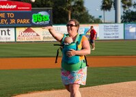 Ashley Waugh, spouse of 17th Airlift Squadron pilot Donald Waugh, throws the first pitch during the Charleston RiverDogs Military Spouse Appreciation Night game April 25, 2013, at the Joseph P. Riley, Jr. Park in Charleston, S.C. The Charleston RiverDogs hosted Military Appreciation night to show their support for the local military. (U.S. Air Force photo/ 2nd Lt. Alexandra Trobe)