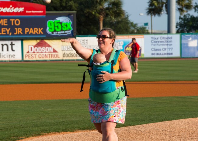 Ashley Waugh, spouse of 17th Airlift Squadron pilot Donald Waugh, throws the first pitch during the Charleston RiverDogs Military Spouse Appreciation Night game April 25, 2013, at the Joseph P. Riley, Jr. Park in Charleston, S.C. The Charleston RiverDogs hosted Military Appreciation night to show their support for the local military. (U.S. Air Force photo/ 2nd Lt. Alexandra Trobe)