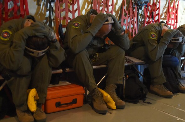433rd Aeromedical Evacuation Squadron’s aircrew aboard a KC-135 from MacDill Air Force Base, Florida practice over water crash procedures, May 16, 2015 over Hilo, Hawaii during the “Alamo Stampede” exercise. (U.S. Air Force Photo/Senior Airman Keith James/Released)