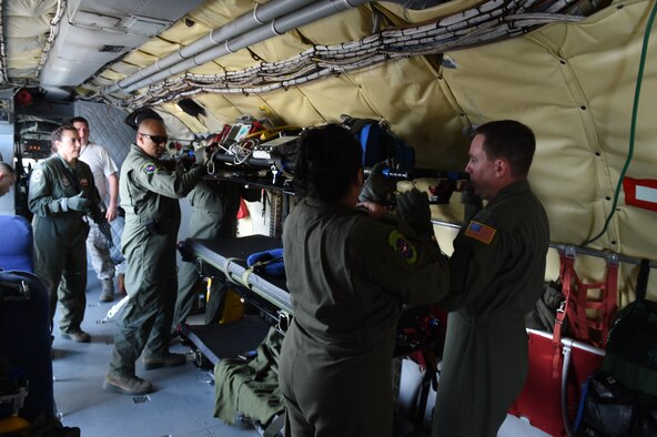 Crewmembers from the 433rd Aeromedical Evacuation Squadron load litters and equipment on to a KC-135 just prior to departing for a training exercise, May 16, 2015 in Hilo, Hawaii, during exercise “Alamo Stampede.” More than 140 members from several squadrons in the 433rd Airlift Wing participated in the event. Training included, egress non-ejection, self aid and buddy care, land and water survival training, air-refueling,  cargo preparation,  and increment monitoring of cargo for inspection during all phases of the flyaway to include pre-deployment, deployment, and redeployment.  (U.S. Air Force Photo/Senior Airman Keith James/Released)