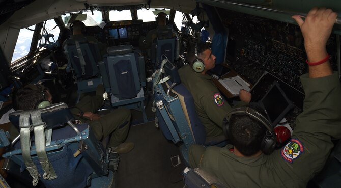 Aircrew members of 433rd Airlift Wing in the cockpit of a C-5A Galaxy aircraft headed to Hilo, Hawaii May 14, 2015 to participate in exercise “Alamo Stampede.” The purpose of the exercise was two-fold, one: to provide mission-ready aircrews to conduct overseas air, land, and air-refueling missions, and two: provide deployable members with ground training from numerous agencies within the wing at the deployed location. (U.S. Air Force Photo/Senior Airman Keith James/Released)