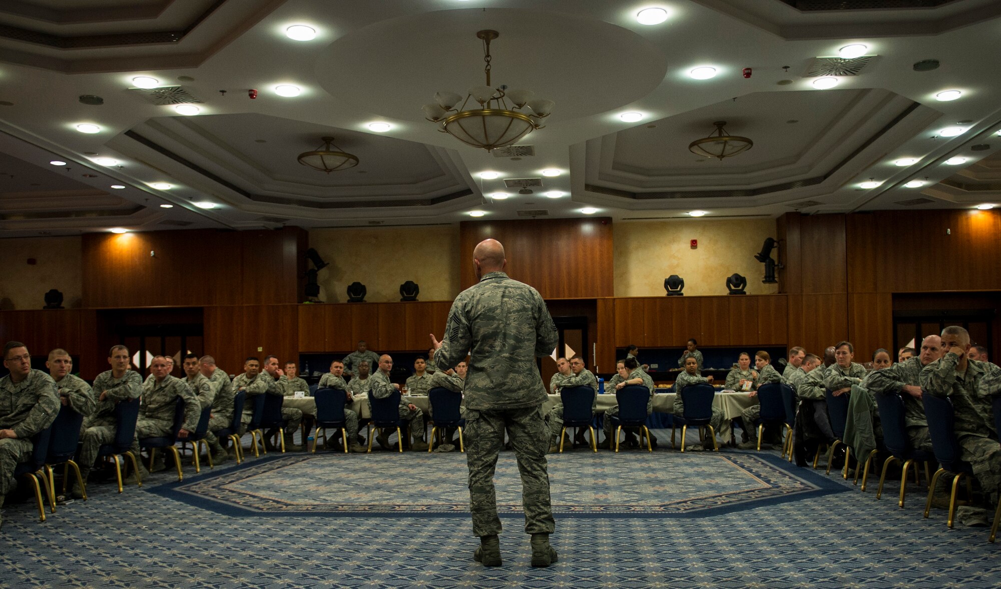 U.S. Air Force Chief Master Sgt. Dale Zmuda, 52nd Security Forces Squadron security forces manager, speaks before the start of a speed-mentoring session at the Club Eifel ballroom on Spangdahlem Air Base, Germany, May 19, 2015. Zmuda mentioned the importance of mentorship in helping Airmen become effective leaders. (U.S. Air Force photo by Airman 1st Class Luke Kitterman/Released)