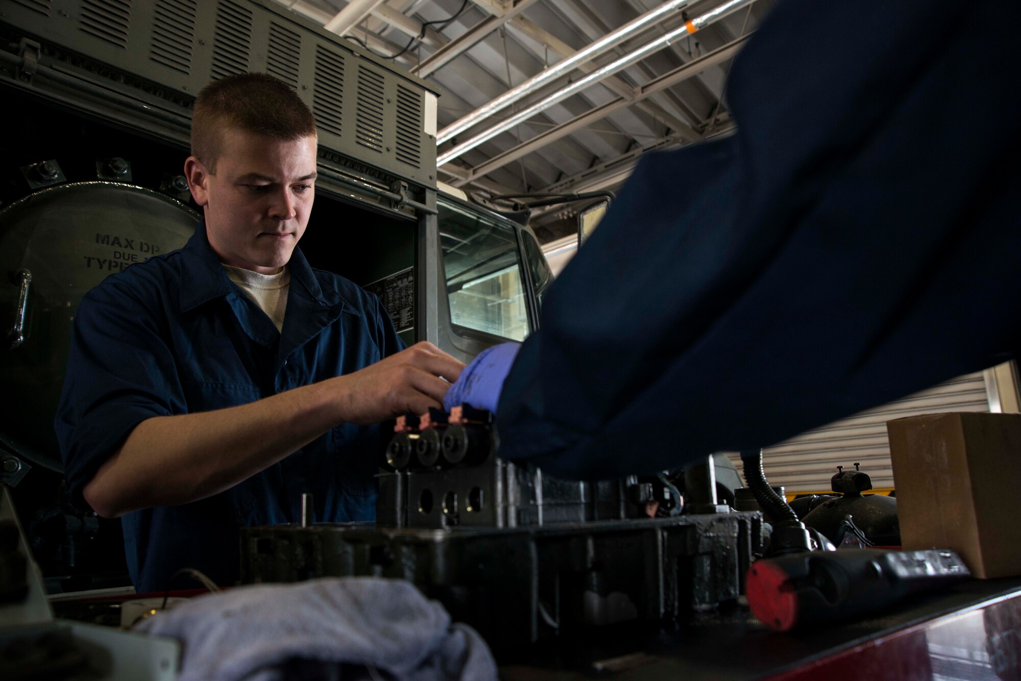 Senior Airman Jonah Myers, 35th Logistics Readiness Squadron fuels repairman, performs maintenance on the transmission of a fuel vehicle May 20, 2015, at Misawa Air Base, Japan. Myers services all the refueling assets at Misawa. (U.S. Air Force photo by Staff Sgt. Derek VanHorn/Released)