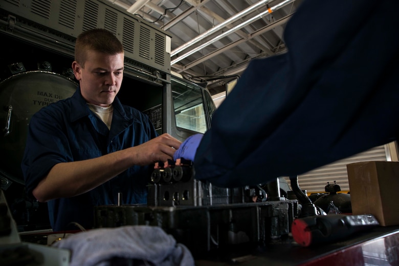 Senior Airman Jonah Myers, 35th Logistics Readiness Squadron fuels repairman, performs maintenance on the transmission of a fuel vehicle May 20, 2015, at Misawa Air Base, Japan. Myers services all the refueling assets at Misawa. (U.S. Air Force photo by Staff Sgt. Derek VanHorn/Released)