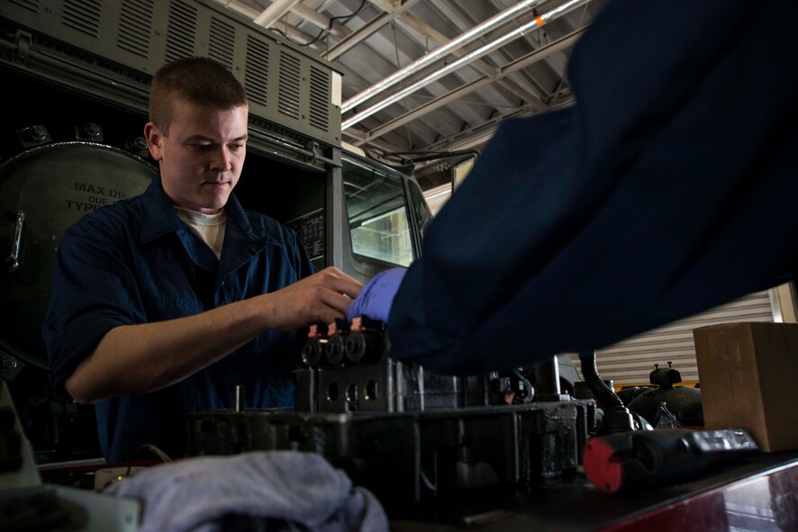 Senior Airman Jonah Myers, 35th Logistics Readiness Squadron fuels repairman, performs maintenance on the transmission of a fuel vehicle May 20, 2015, at Misawa Air Base, Japan. Myers services all the refueling assets at Misawa. (U.S. Air Force photo by Staff Sgt. Derek VanHorn/Released)