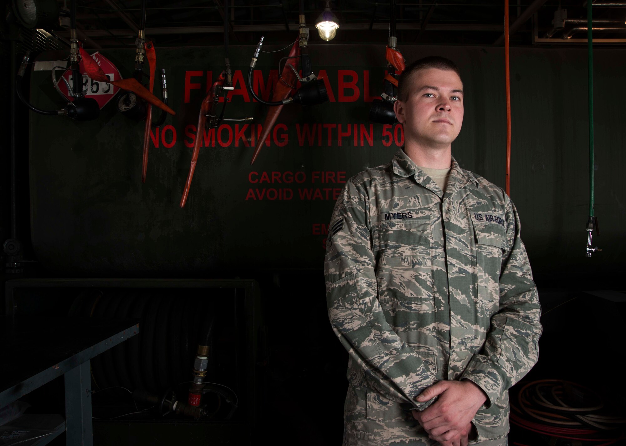 Senior Airman Jonah Myers, 35th Logistics Readiness Squadron fuels repairman, stands in a maintenance garage May 20, 2015, at Misawa Air Base, Japan. Myers was selected as Misawa's Wild Weasel of the Week, and his job is to maintain and repair all air force refueling assets at the base. (U.S. Air Force photo by Staff Sgt. Derek VanHorn/Released)