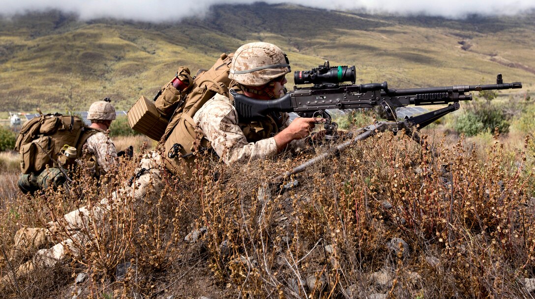 U.S. Marine Corps Sgt. Michael T. Potts provides security with his M240 machine gun during an airfield seizure exercise on Bradshaw Airfield at a training area in Pohakuloa, Hawaii, May 19, 2015. Potts is assigned to Charlie Company, 1st Battalion, 3rd Marine Regiment.