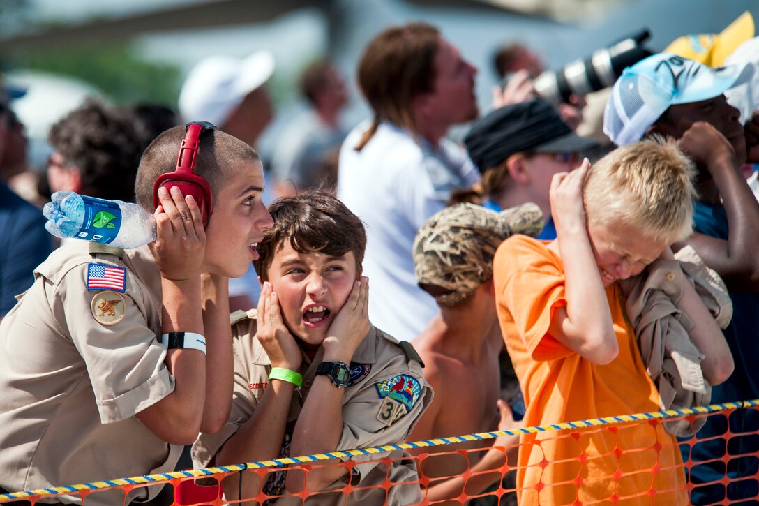 Fans react to U.S. Air Force Thunderbirds' sneak pass maneuver during the Wings Over Wayne Airshow at Seymour Johnson Air Force Base, N.C., May 16, 2015.