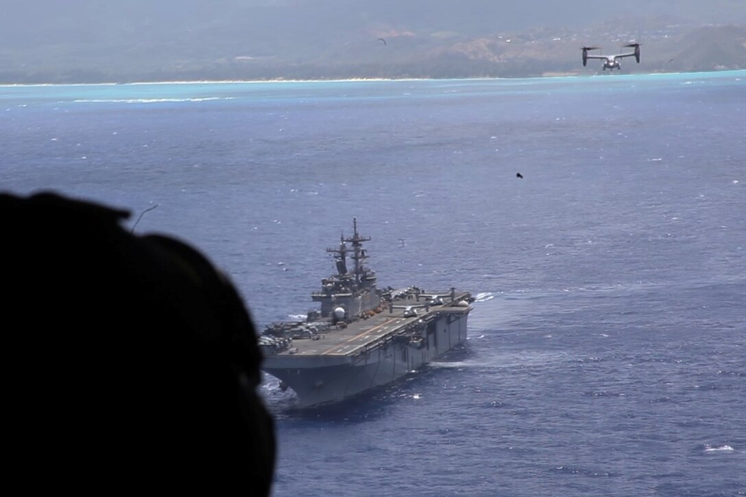 U.S. Marines with the 15th Marine Expeditionary Unit depart the USS Essex (LHD 2) in MV-22B Ospreys off the coast of Hawaii, May 19, 2015. These Marines demonstrated the capabilities of an amphibious raid during the U.S. Pacific Command Amphibious Leadership Symposium (PALS). PALS is designed to bring together senior leaders from allied and partner Marine Corps, naval infantries and militaries around the Pacific with interest in military amphibious capability development. (U.S. Marine Corps photo by Staff Sgt. Miguel Carrasco/Released)