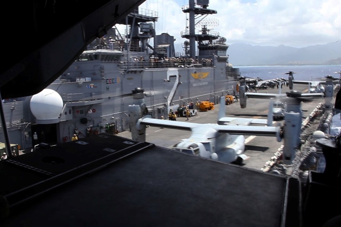 U.S. Marines with the 15th Marine Expeditionary Unit depart the USS Essex (LHD 2) in MV-22B Ospreys off the coast of Hawaii, May 19, 2015. These Marines demonstrated the capabilities of an amphibious raid during the U.S. Pacific Command Amphibious Leadership Symposium (PALS). PALS is designed to bring together senior leaders from allied and partner Marine Corps, naval infantries and militaries around the Pacific with interest in military amphibious capability development. (U.S. Marine Corps photo by Staff Sgt. Miguel Carrasco/Released)