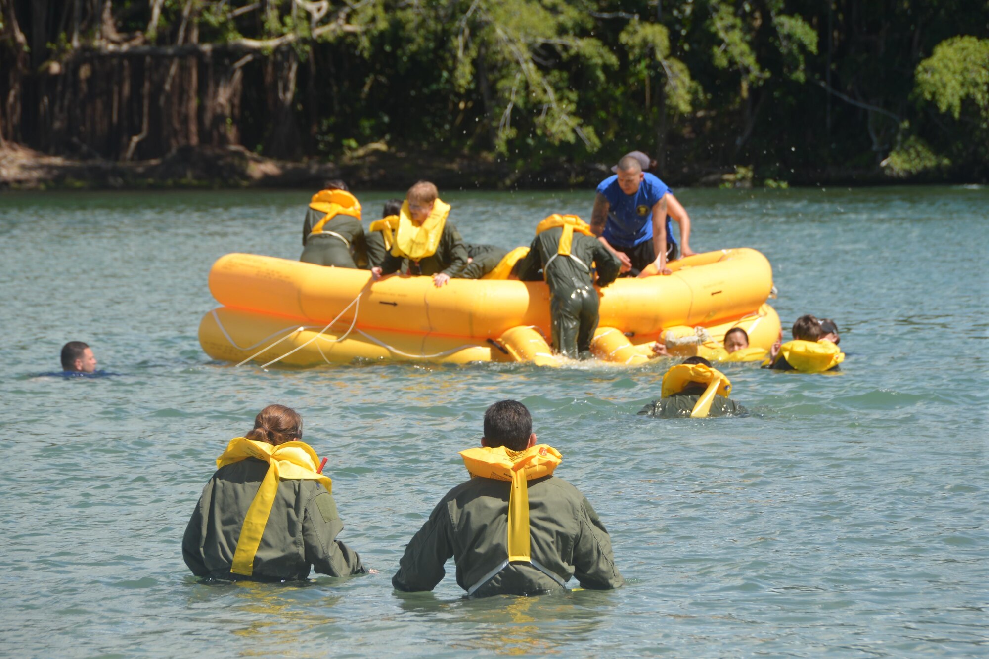 Aircrew members of the 433rd Operations Group perform water survival training May 16, 2015 at Reeds Bay Beach Park, Hilo, Hawaii. Water survival training was part of exercise “Aloha Stampede.” More than 140 members from several squadrons from the 433rd Airlift Wing participated in the event. (U.S. Air Force photo/Minnie Jones) 
