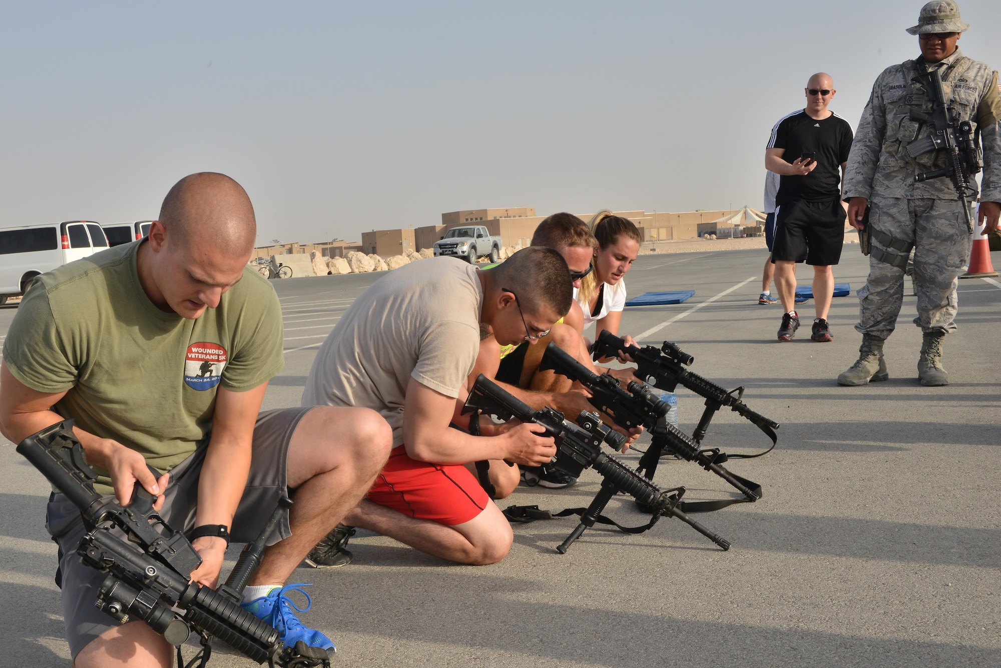Al Udeid Police week Combat challenge participants are timed on weapon assembly as part of a combat challenge for National Police week May 14, 2015 at Al Udeid Air Base, Qatar. National Police was established to honor American law enforcement in 1962 to help gain recognition to officers that have lost their lives in the line of duty. (U.S. Air Force photo by Staff Sgt. Alexandre Montes)   