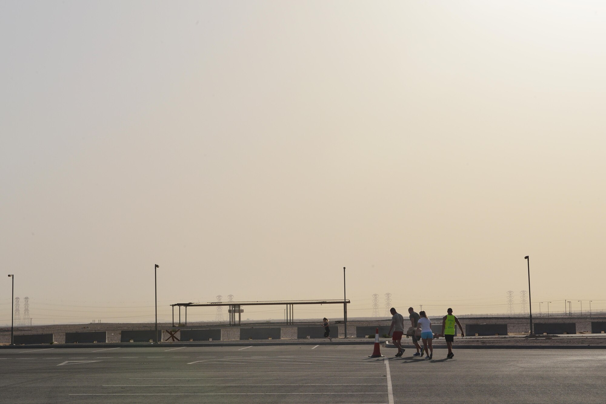 Airmen from the 379th Expeditionary Security Forces Squadron complete a litter carry relay during a combat challenge as part of National Police week event May 14, 2015 at Al Udeid Air Base, Qatar. National Police was established to honor American law enforcement in 1962 to help gain recognition to officers that have lost their lives in the line of duty. (U.S. Air Force photo by Staff Sgt. Alexandre Montes)   