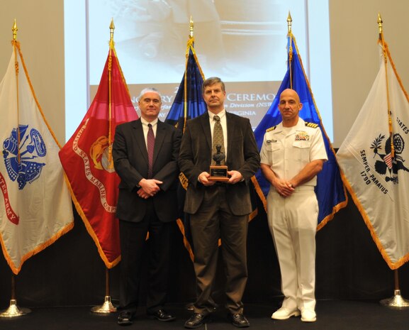 Dr. Orgal Thomas Holland received the John Adolphus Dahlgren Award for his technical excellence in implementing modeling and simulation to enhance naval warfighting capabilities at the Naval Surface Warfare Center Dahlgren Division (NSWCDD) annual honor awards ceremony on May 14, 2015.