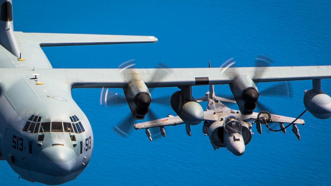 A Spanish Navy Harrier flies behind a U.S. Marine KC-130J from Special-Purpose Marine Air-Ground Task Force Crisis Response-Africa during aerial-refueling training off the coast of Spain May 15, 2015. The Spanish and American pilots coordinated their movements to allow the Harrier to connect with a refueling line extended from the wing of the Marine aircraft. 